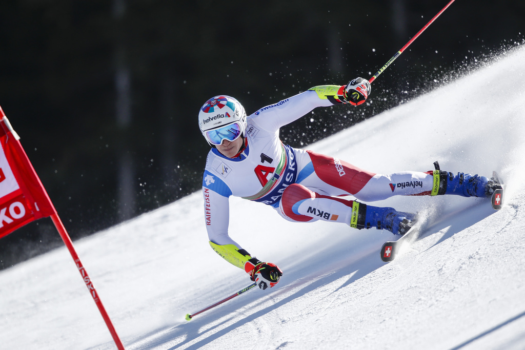 Sweitzerland's Marco Odermatt speeds down the slope during an alpine ski, men's World Cup giant slalom, in Bansko, Saturday, Feb. 27, 2021. (AP Photo/Gabriele Facciotti)