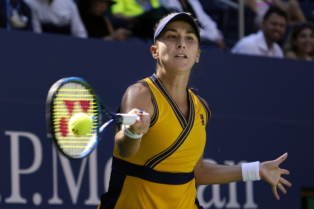 Belinda Bencic, of Switzerland, returns a shot against Iga Swiatek, of Poland, during the fourth round of the US Open tennis championships, Monday, Sept. 6, 2021, in New York. (AP Photo/Elise Amendola)