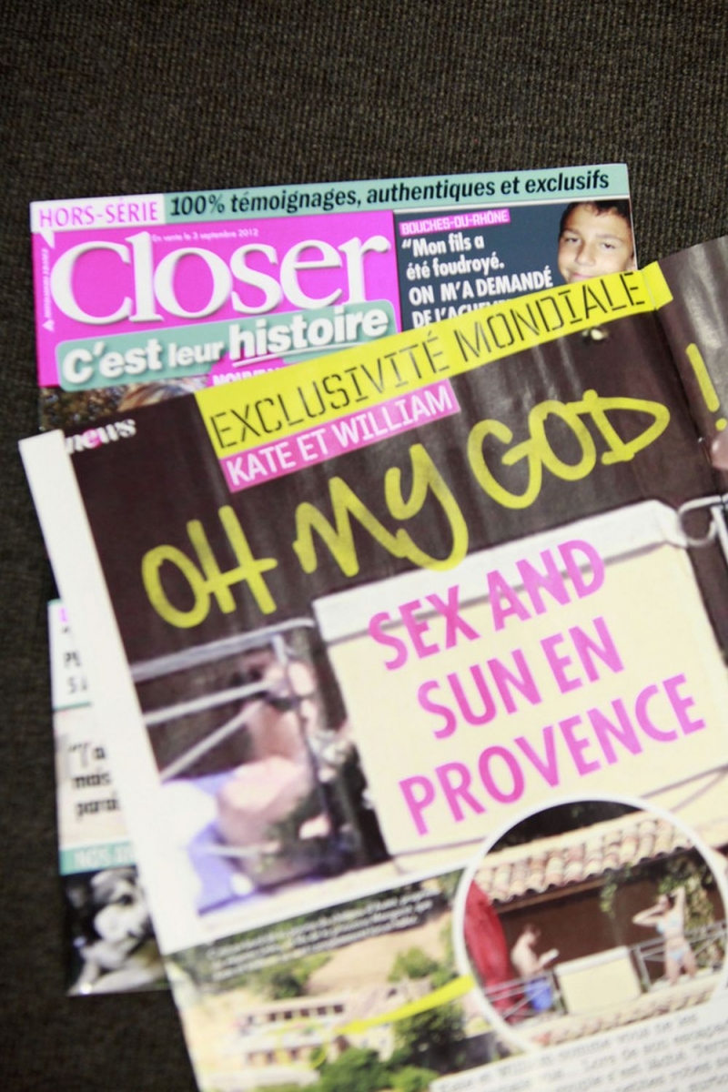 An issue of Closer magazine as published Friday and displayed at the magazine's headquarter office, in Montrouge, near to Paris, Friday, Sept. 14, 2012.  The magazine on Friday published what appeared to be photos of Britain's Prince William and his wife Kate sunbathing topless at a private estate in southern France, prompting a strong condemnation from Britain's royal family. (AP Photo/Thibault Camus)