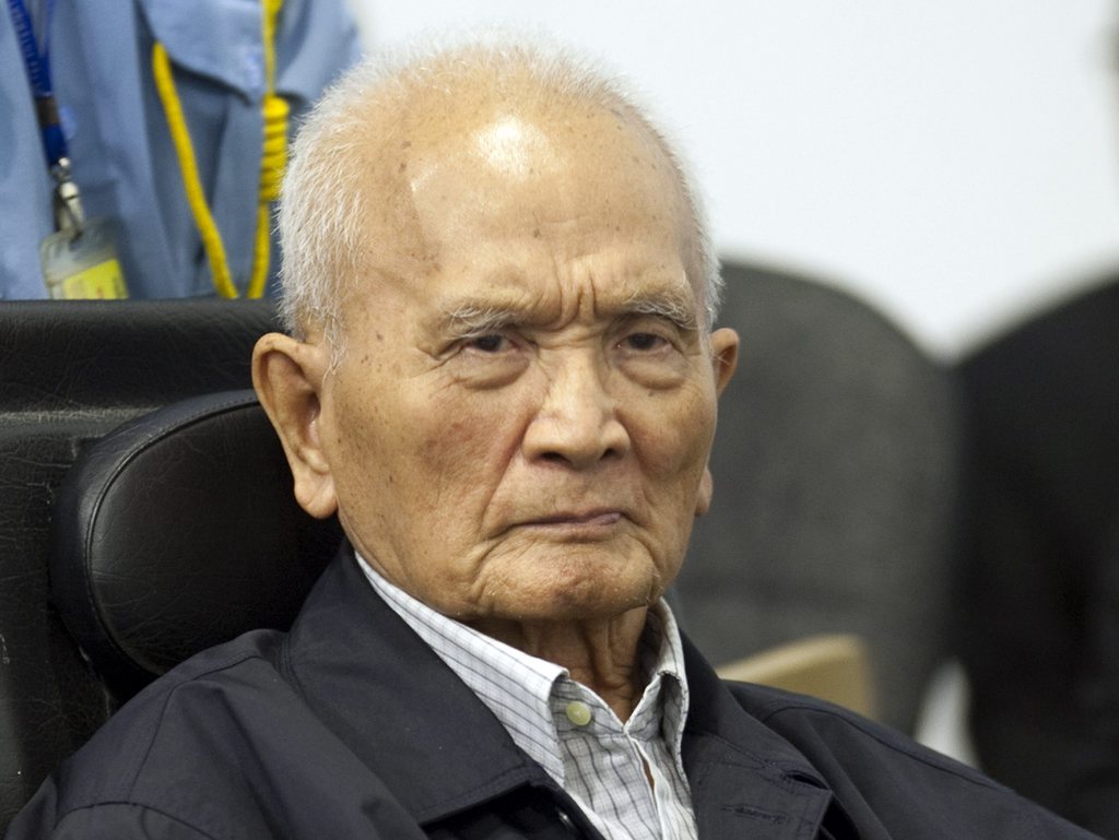 In this photo released by the Extraordinary Chambers in the Courts of Cambodia, Nuon Chea, who was the Khmer Rouge's chief ideologist and No. 2 leader, waits before his final statements at the U.N.-backed war crimes tribunal in Phnom Penh, Cambodia, Thursday, Oct. 31, 2013. Former Khmer Rouge leader Nuon Chea has denied all charges against him on the last day of a trial for leaders of the Cambodian regime widely blamed for the deaths of some 1.7 million people. (AP Photo/Extraordinary Chambers in the Courts of Cambodia, Mark Peters)