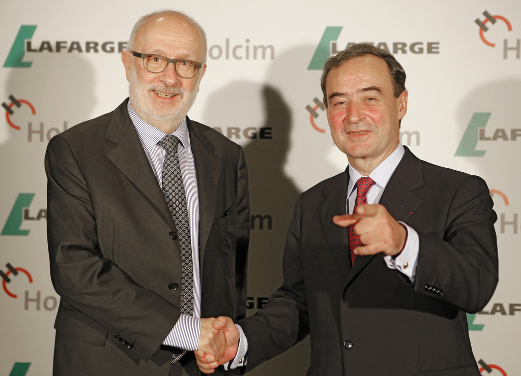 Bruno Lafont, à droite, le PDG de Lafarge et Rolf Soiron, son homologue d'Holcim, doivent vendre certaines parties de leur entreprise.