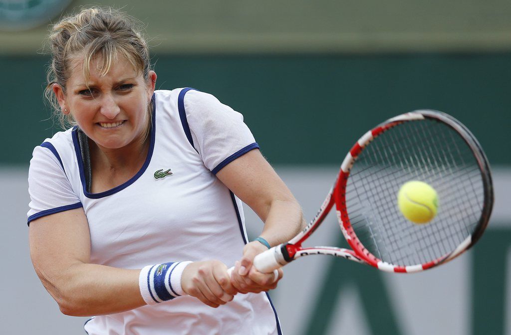 Timea Bacsinszky of Switzerland returns to Maryna Zanevska of Ukraine during their first round match for the French Open tennis tournament at Roland Garros in Paris, France, 26 May 2014.  EPA/IAN LANGSDON