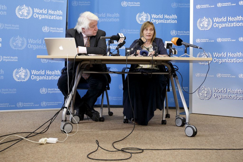 Marie-Paule Kieny, right, Assistant Director General of the World Health Organization (WHO), sitting next to Gregory Haertl, left, Spokesperson of WHO, informs to the media following a panel of medical ethicists to explore experimental treatment in the Ebola outbreak, at the headquarters of the World Health Organization (WHO) in Geneva, Switzerland, Tuesday, August 12, 2014. (KEYSTONE/Salvatore Di Nolfi)