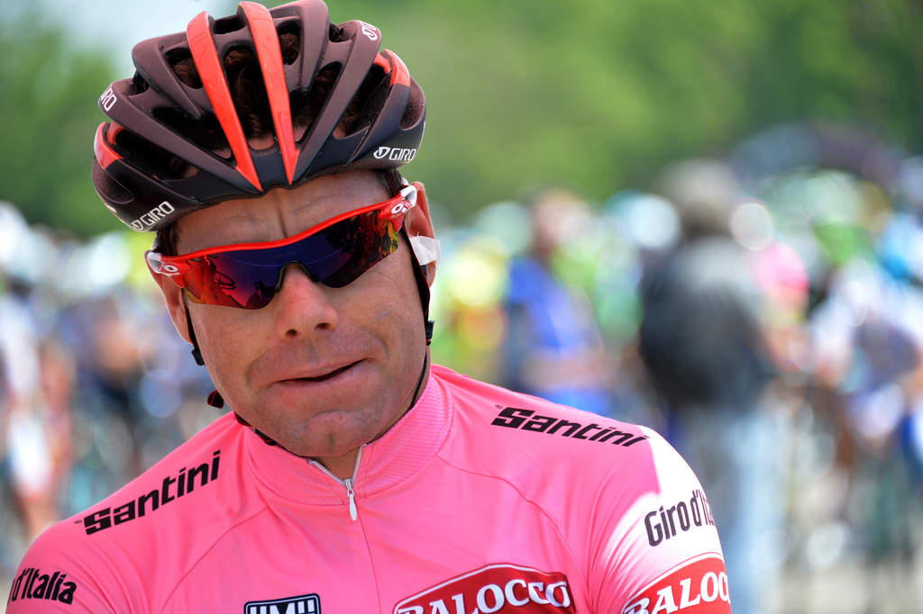 Overall leader Cadel Evans, center, waits for start of the 10th stage of the Giro d'Italia, Tour of Italy cycling race, from Modena to Salso Maggiore, Italy, Tuesday, May 20, 2014. (AP Photo/Gian Mattia D'Alberto)