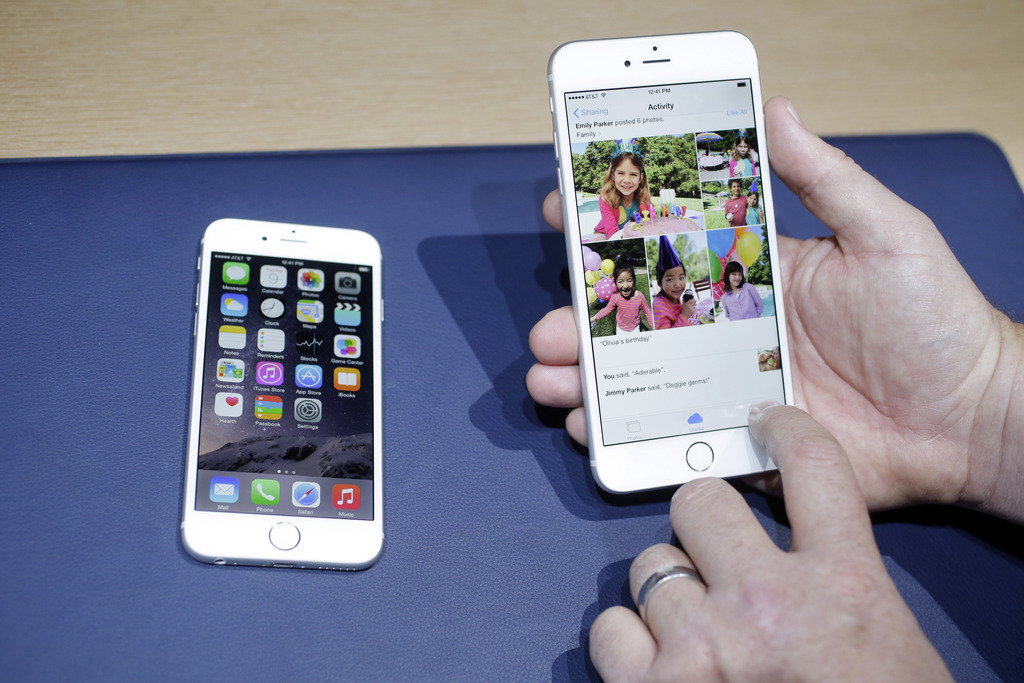 The iPhone 6, at left, and iPhone 6 plus are shown next to each other during a new product release on Tuesday, Sept. 9, 2014, in Cupertino, Calif. (AP Photo/Marcio Jose Sanchez)