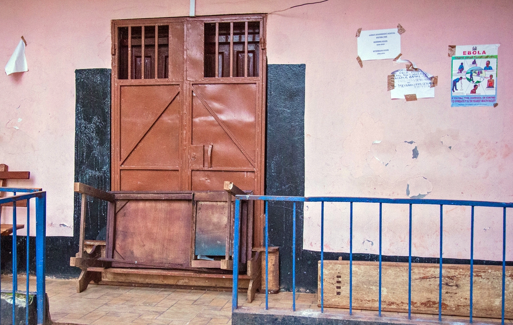 A barricaded door at the Lumley Government Hospital, that was closed after medical doctor Olivet Buck contracted the Ebola virus and died on Saturday near the city of Freetown, Sierra Leone, Monday, Sept. 15, 2014. Sierra Leone accused the World Health Organization on Monday of being ?sluggish? in facilitating an evacuation of a doctor who died from Ebola before she could be sent out of the country for medical care. Dr. Olivet Buck died Saturday, hours after the U.N. health agency said it could not help evacuate her to Germany. (AP Photo/ Michael Duff)