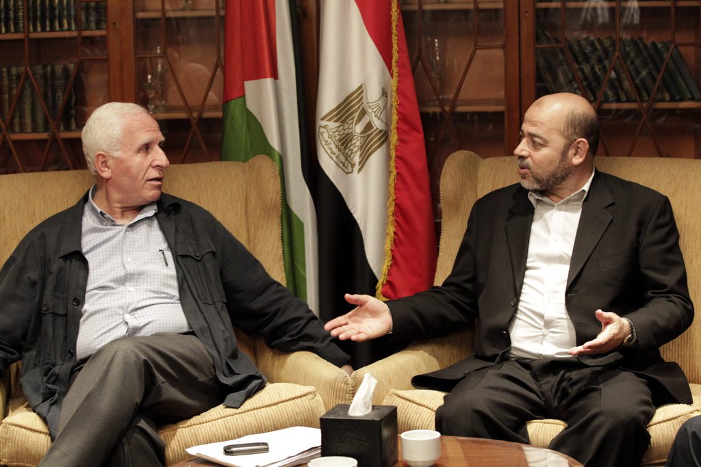 epa04415419 Member of Palestinian Fatah party, Azzam al-Ahmad (L), meets with Hamas politburo member Musa Abu Marzouk (R)  at a hotel in Cairo, Egypt, 24 September 2014. Media reports state indirect Israeli-Palestinian negotiations on a long-term Gaza truce started in Cairo on 23 September, days before expiry of a one-month truce that temporarily ended 50 days of deadly cross-border fighting. Fatah and Hamas are also holding separate Egyptian-mediated talks in Cairo in a bid to reach a unified stance on Gaza between the two Palestinian rivals  EPA/KHALED ELFIQI