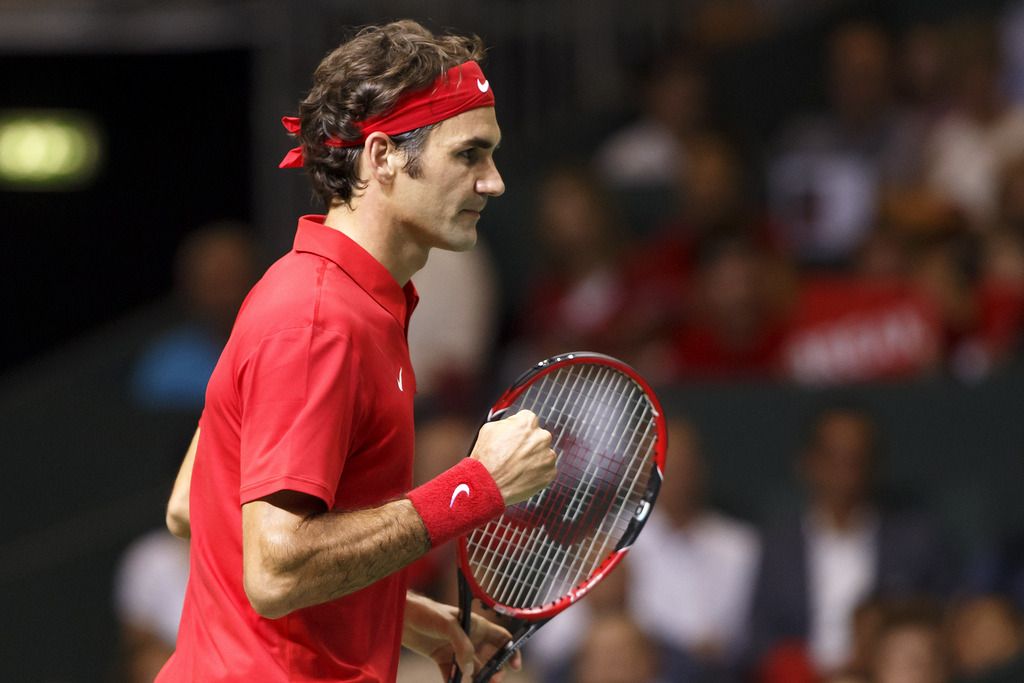 Roger Federer, of Switzerland, reacts after winning the second set against to Fabio Fognini, of Italy, during the third single match of the Davis Cup World Group Semifinal match between Switzerland and Italy, at Palexpo, in Geneva, Switzerland, Sunday, September 14, 2014. (KEYSTONE/Salvatore Di Nolfi)