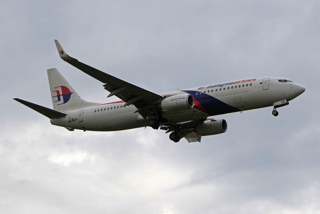 In this photo taken on Friday, Aug. 29, 2014, a Malaysia Airlines plane approaches to land at Kuala Lumpur International Airport in Sepang in Malaysia. A Malaysia Airlines flight to Hyderabad, India, was forced to return to Kuala Lumpur on Sunday, Sept. 14, 2014, due to an autopilot defect shortly after takeoff. The airline said the defect didn't affect the safety of the aircraft or passengers but the captain turned back as a precaution. (AP Photo/Lai Seng Sin)