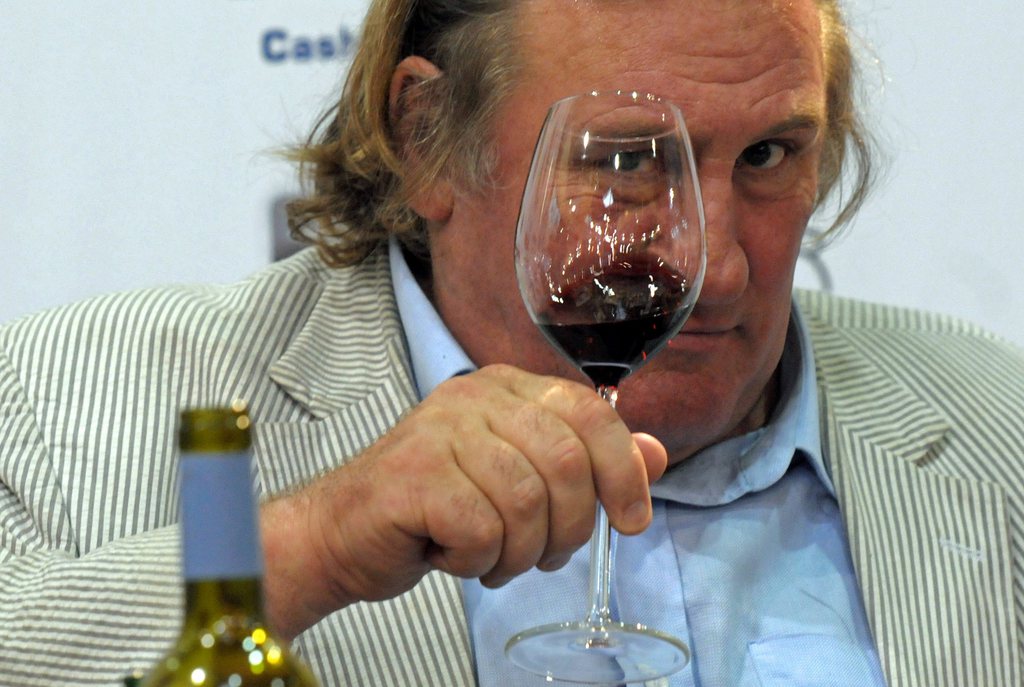 epa03520336 (FILE) A file picture dated 12 September 2010 shows French actor Gerard Depardieu presenting his self-made wine '2006 Anjou AOC Vieilles Vignes' at the Hogatec International Fair for hotel industry, gastronomy and collective catering, in Duesseldorf, Germany. In December 2012 Depardieu bought a house in Nechin, Belgium. Nechin has many rich French residents who prefer Belgium's lower income taxes. On 29 December, French President Hollande's plan to tax annual earnings over one million euros by 75 per cent was overturned by constitutional review.  EPA/HORST? OSSINGER *** Local Caption *** 02331305