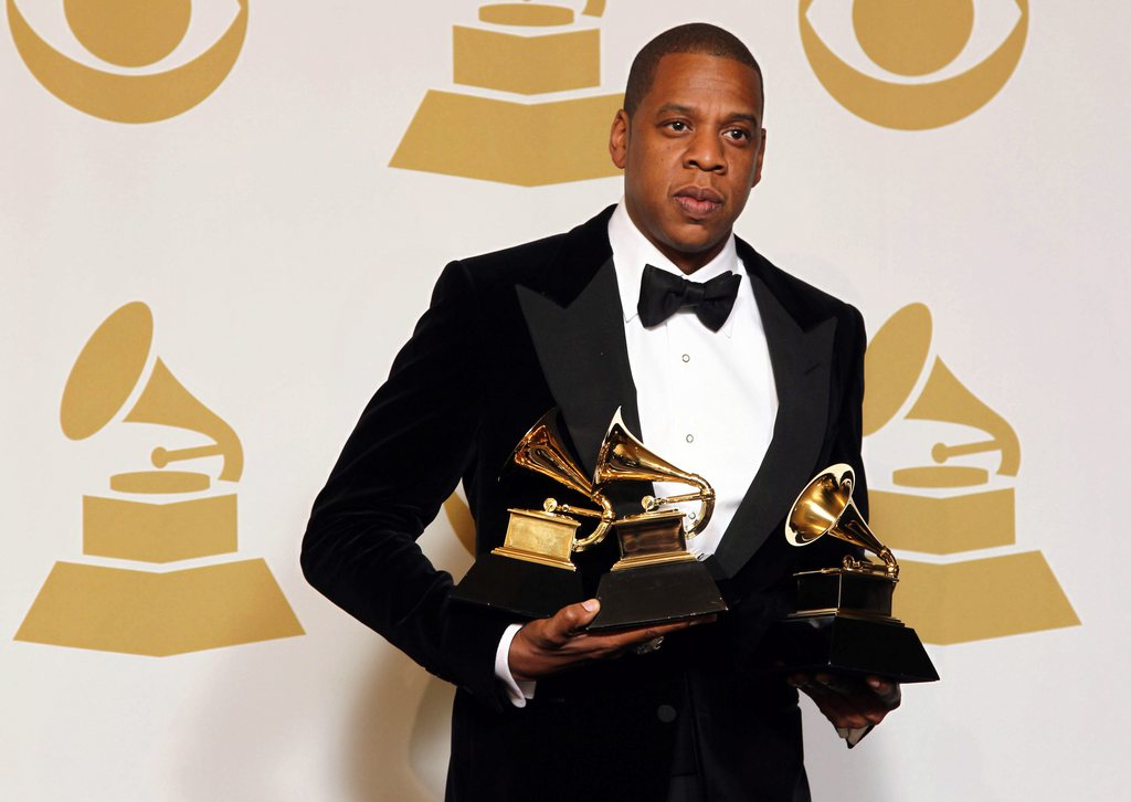 Jay-Z poses backstage with the awards for best rap/sung collaboration for "No Church in the Wild" and best rap performance for "N****s in Paris" at the 55th annual Grammy Awards on Sunday, Feb. 10, 2013, in Los Angeles. (Photo by Matt Sayles/Invision/AP)