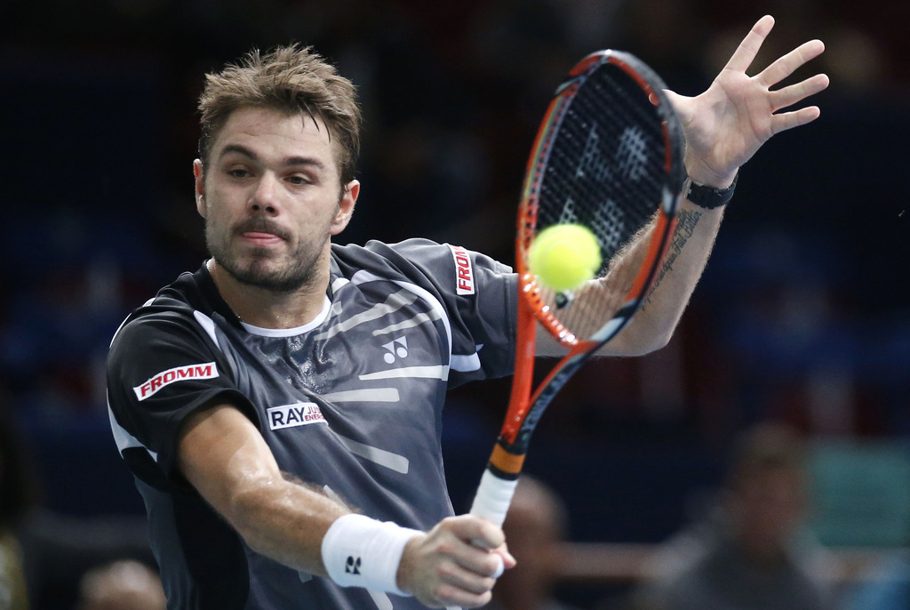 Stanislas Wawrinka of Switzerland, returns the ball to Kevin Anderson of South Africa during their third round match at the ATP World Tour Masters tennis tournament at Bercy stadium in Paris, France, Thursday, Oct. 30, 2014. (AP Photo/Michel Euler)