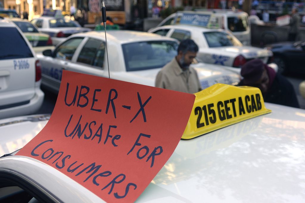 Drivers with the Taxi Workers Alliance of Pennsylvania protest on near Love Park in Philadelphia Oct. 8, 2014, as Uber and Lyft are making a concerted push to bring their ride-share services to Philadelphia. The state's Public Utility Commission is expected to vote Thursday Nov. 13, 2014 on Uber X's application to operate in many other parts of Pennsylvania. (AP Photo/Philadelphia Inquirer, Tom Gralish)