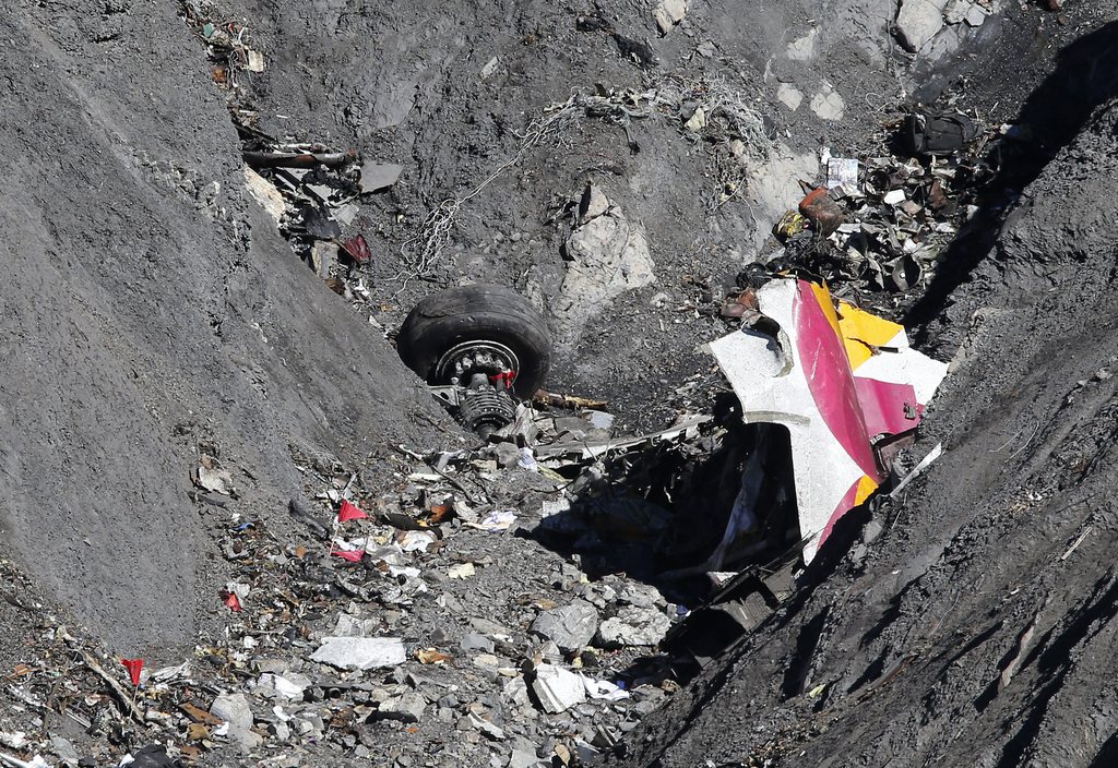 epa04680366 Debris as search and rescue workers are at the crash site of the Germanwings Airbus A320 that crashed in the French Alps, above the town of Seyne-les-Alpes, southeastern France, 26 March 2015. Germanwings Flight 4U 9525, carrying 144 passengers and six crew members from Barcelona, Spain to Dusseldorf, Germany, crashed 24 March in the French Alps, where searchers combed a 4-hectare section of mountain face since 25 March. The co-pilot deliberately crashed the aircraft, French officials said on 26 March.  EPA/SEBASTIEN NOGIER
