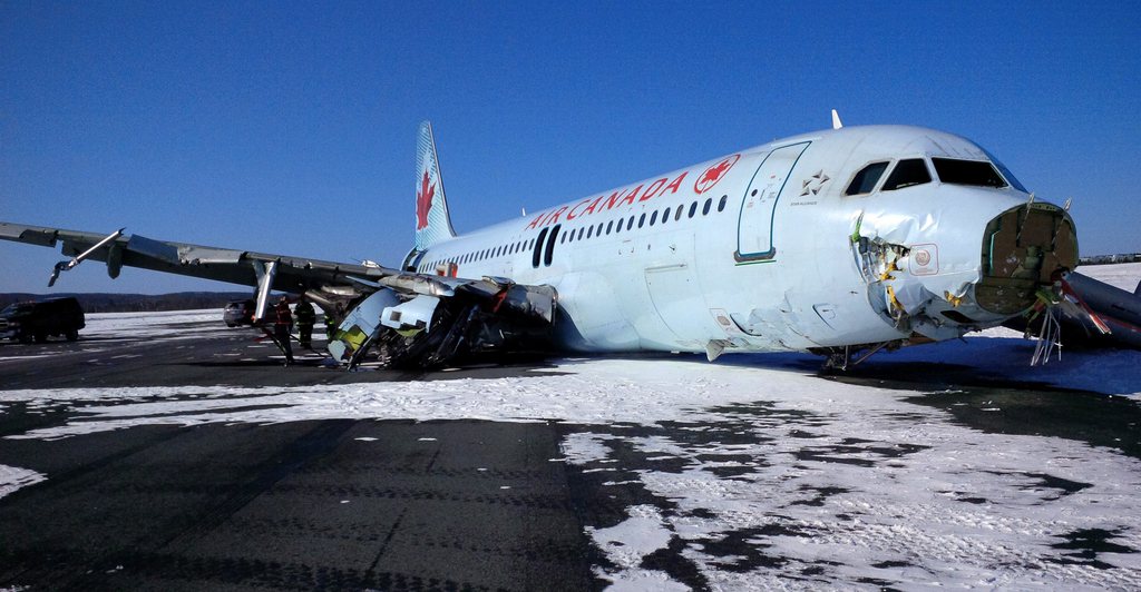This photo provided by the Transportation Safety Board of Canada shows a Air Canada Airbus A-320 at Halifax International Airport after making an "abrupt" landing and skidding off the runway in bad weather early Sunday, March 29, 2015. Officials said 23 people were taken to a hospital for observation and treatment of minor injuries, none of which were considered life threatening. (AP Photo/The Transportation Safety Board of Canada)