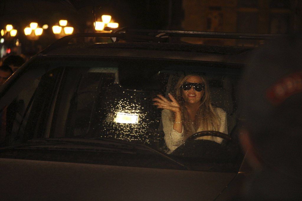 Khloe Kardashian waves from a car as she with her sister Kim Kardashian arrives at  a hotel in downtown Yerevan, Armenia, Wednesday, April 8, 2015. American television star Kim Kardashian has arrived in the capital of her ancestral Armenia for a visit expected to draw attention to the centennial of the massacre of 1.5 million Armenians. (AP Photo/Samvel Berkibekyan, PAN Photo)