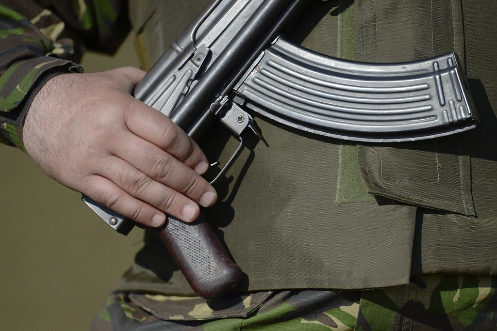 A Romanian Military Police officer stands guard in front of military command tents at Smardan shooting range, near Galati, Romania, Wednesday, April 15, 2015.  Some 2,200 Romanian, U.S., British and Moldovan troops will take part in ?Wind Spring 15? military exercises at a shooting range and an airbase near the Black Sea close to the border with Moldova and Ukraine, Romanian Defense Minister Mircea Dusa confirmed Wednesday.  (AP Photo/Octav Ganea, Mediafax) ROMANIA OUT