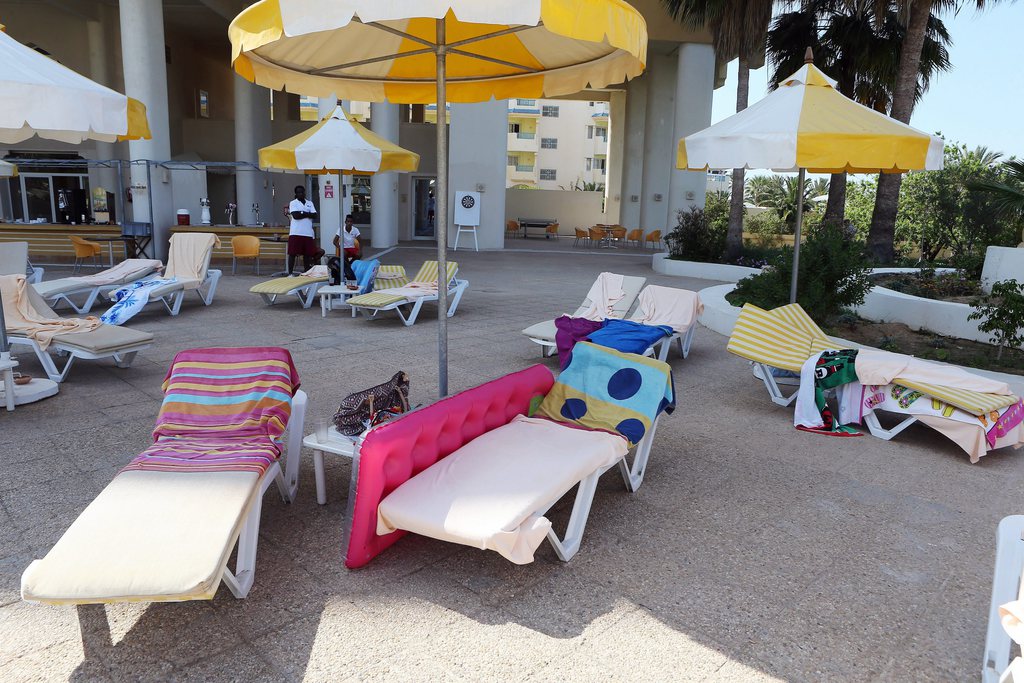 epa04820231 Deck chairs with towels lie abandoned at the Imperial Marhaba Hotel in the resort town of al-Sousse, a popular tourist destination 140 km south of Tunis,Tunisia, June 26 June 2015. According to local reports unknown assailants detonated at least one bomb then opened fire on tourists at two hotels, killing at least 28, including Germans, Brits and Belgians and wounding several others, some while they were sunbathing, at least one of the attackers was killed by Tunisian security services, while a second has been arrested.  EPA/MOHAMED MESSARA