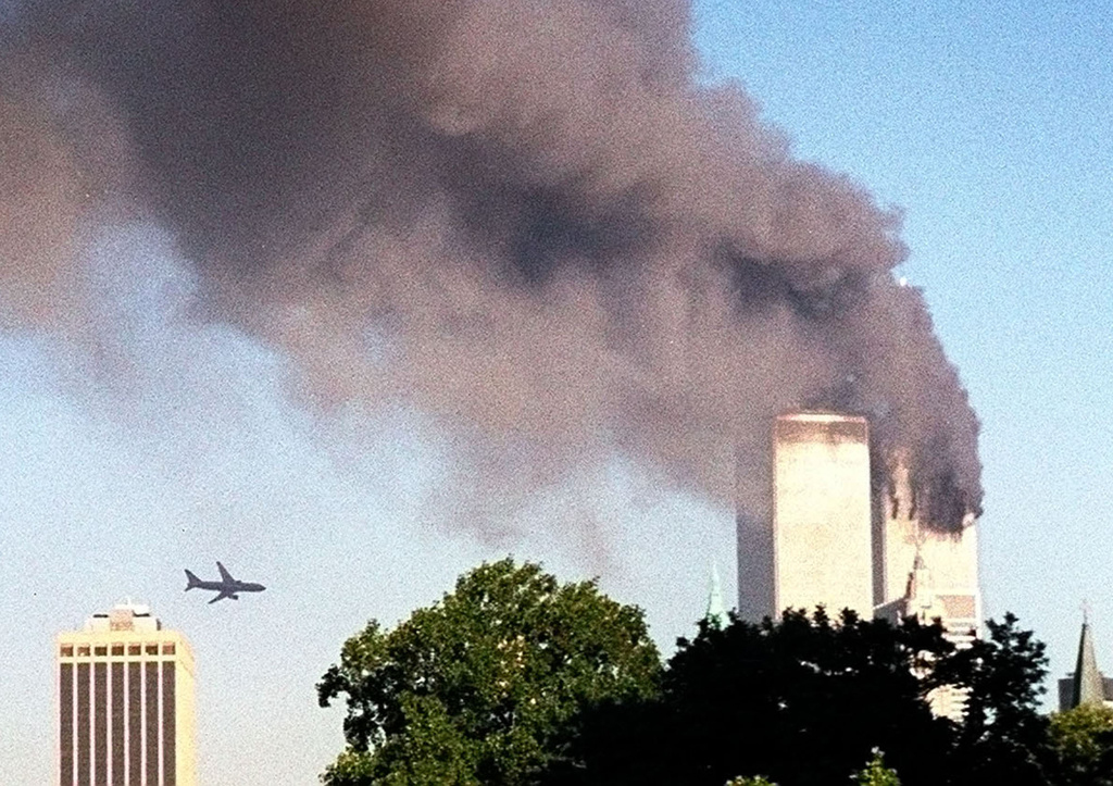 FILE - In this Tuesday, Sept. 11, 2001 file photo, United Airlines Flight 175 approaches the south tower of the World Trade Center in New York moments before collision, seen from the Brooklyn borough of New York. (AP Photo/ William Kratzke) === TUESDAY, SEPT. 11, 2001 FILE PHOTO; PART OF A PACKAGE OF FILE PHOTOS FOR USE WITH THE ANNIVERSARY OF SEPT. 11, 2001 ===