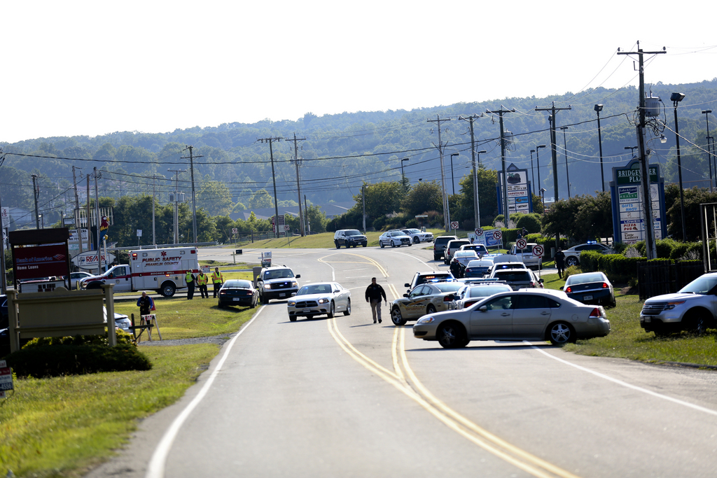 Authorities block Booker T. Washington Highway at Bridgewater Plaza, Wednesday, Aug. 26, 2015, in Moneta, Va., after two journalists were fatally shot while broadcasting live from the plaza earlier in the day. (Stephanie Klein-Davis/The Roanoke Times via AP)