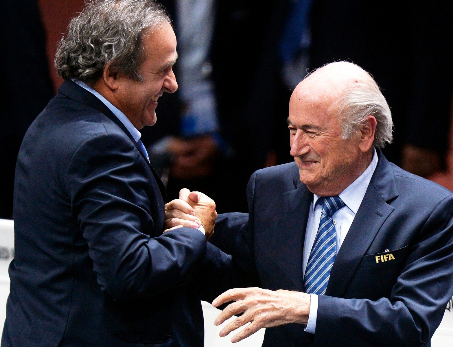 epa04948798 (FILE) A file picture dated 29 May 2015 of FIFA President Joseph Blatter (R) being congratulated by UEFA President Michel Platini (L) after his election as FIFA president during the 65th FIFA Congress in Zurich, Switzerland. The Office of the Attorney General of Switzerland (OAG) on 24 September 2015 has opened criminal proceedings against FIFA president Joseph Blatter on suspicion of criminal mismanagement and misappropriation, media reports stated on 25 September 2015. Blatter is suspected of a disloyal payment of 2 million Swiss francs (1.83 million euro) to UEFA president Michel Platini.  EPA/WALTER BIERI *** Local Caption *** 52088459 FILE SWITZERLAND SOCCER FIFA