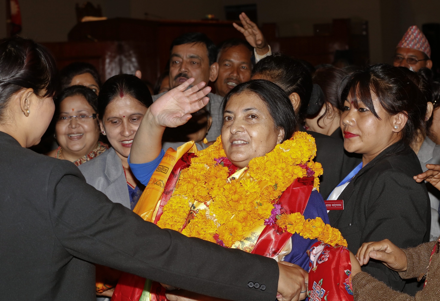 epa04999859 Nepal's first elected woman president Bidhya Bhandari waves after she is elected as New President of Nepal at the parliament in Kathmandu, Nepal, 28 October 2015. Bhandari who is the widow of the deceased chairman of the Communist Party of Nepal-Unified Marxist-Leninist (UML) Madan Bhandari, won 327 votes to beat her competitor Kulbahadur Gurung, who got 214 votes, to secure the largely ceremonial post.  EPA/NARENDRA SHRESTHA