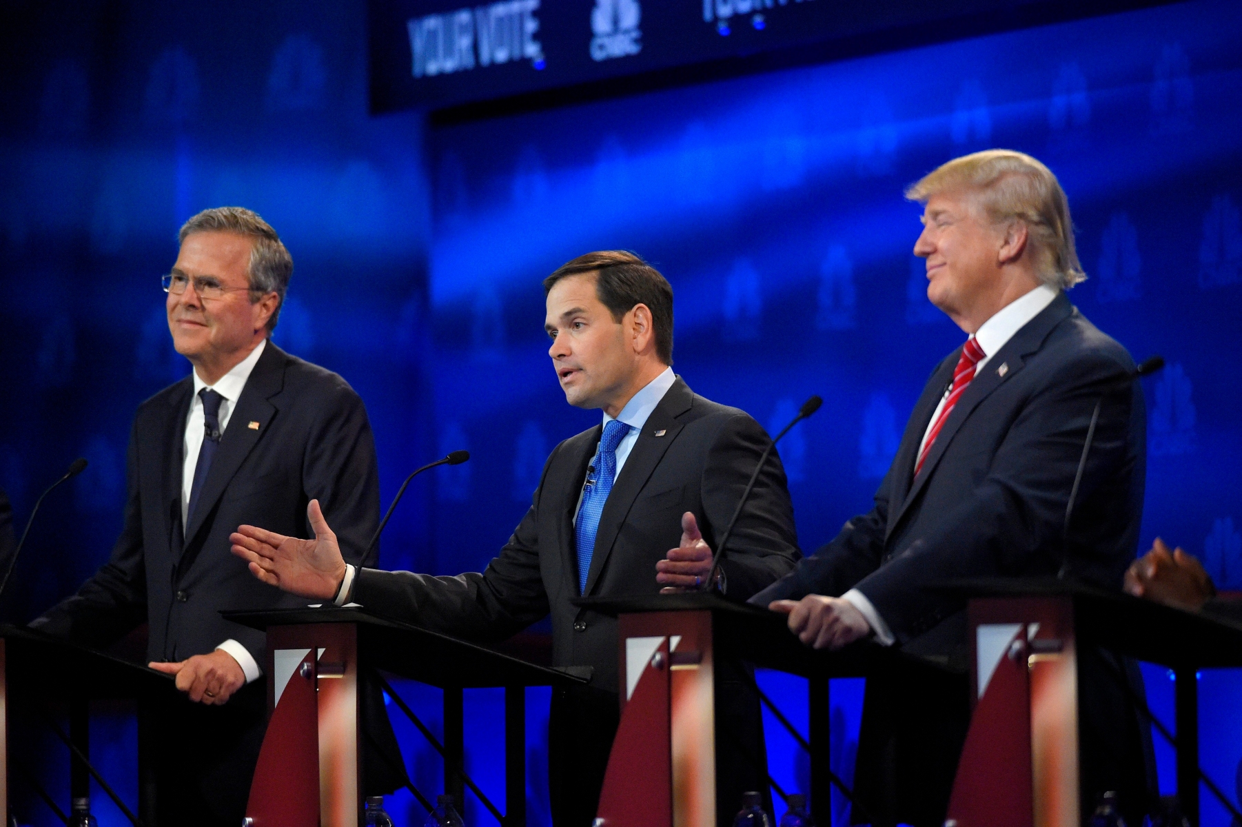 Marco Rubio, center, speaks as Jeb Bush, left, and Donald Trump react during the CNBC Republican presidential debate at the University of Colorado, Wednesday, Oct. 28, 2015, in Boulder, Colo. (AP Photo/Mark J. Terrill) GOP 2016 Debate