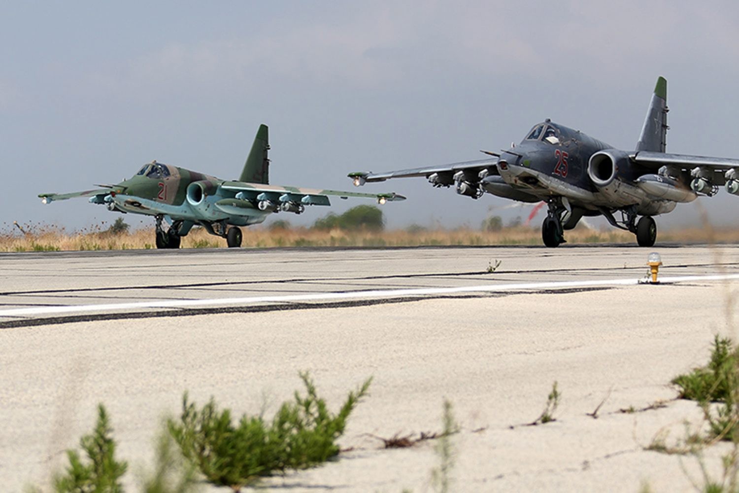 epa04966911 A handout picture dated 03 October 2015 made available on the official website of the Russian Defence Ministry on 06 October 2015 shows two Russian SU-25  strike fighters taking off from the Syrian Hmeymim airbase, outside Latakia, Syria. Russian warplanes involved in carrying out airstrikes against what Russia says terrorist Islamic State (ISIS or IS) facilities is deployed at the Hmeymim airbase.  EPA/RUSSIAN DEFENCE MINISTRY PRESS SERVICE/HANDOUT  HANDOUT EDITORIAL USE ONLY/NO SALES SYRIA RUSSIA AIR STRIKES