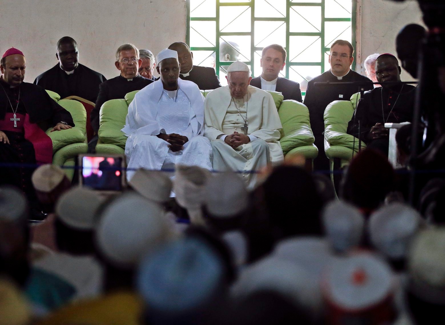 Pope Francis, flanked by the Imam Tidjani of the Koudoukou mosque, meets with the Muslim community at the Koudoukou mosque on the occasion of his visit, in Bangui, Central African Republic, Monday, Nov. 30, 2015. (AP Photo/Andrew Medichini) Africa Pope Central African Republic