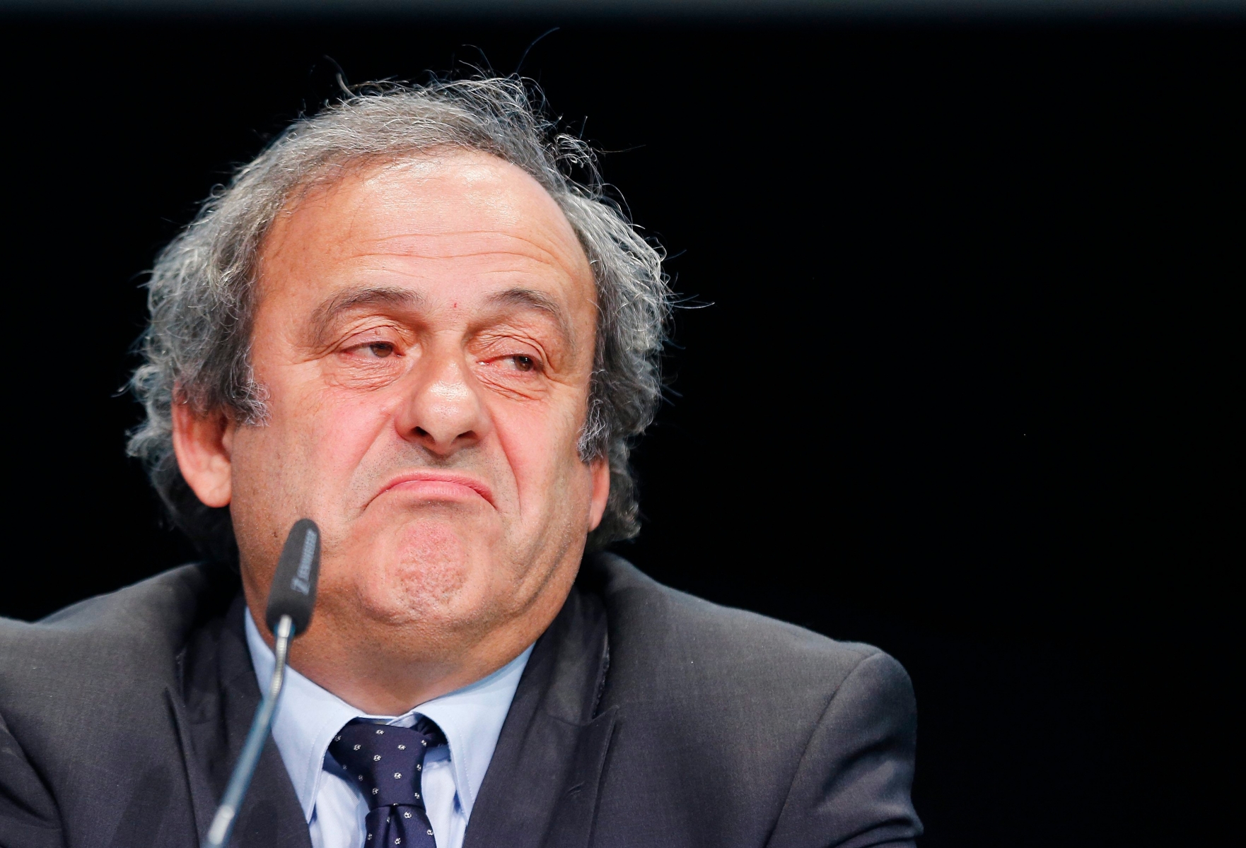 FILE - in This May 28, 2015 file photo UEFA president Michel Platini grimaces during a press conference following a meeting of the UEFA board ahead of the FIFA congress in a hotel in Zurich, Switzerland.  (AP Photo/Michael Probst, file) Soccer FIFA Investigation