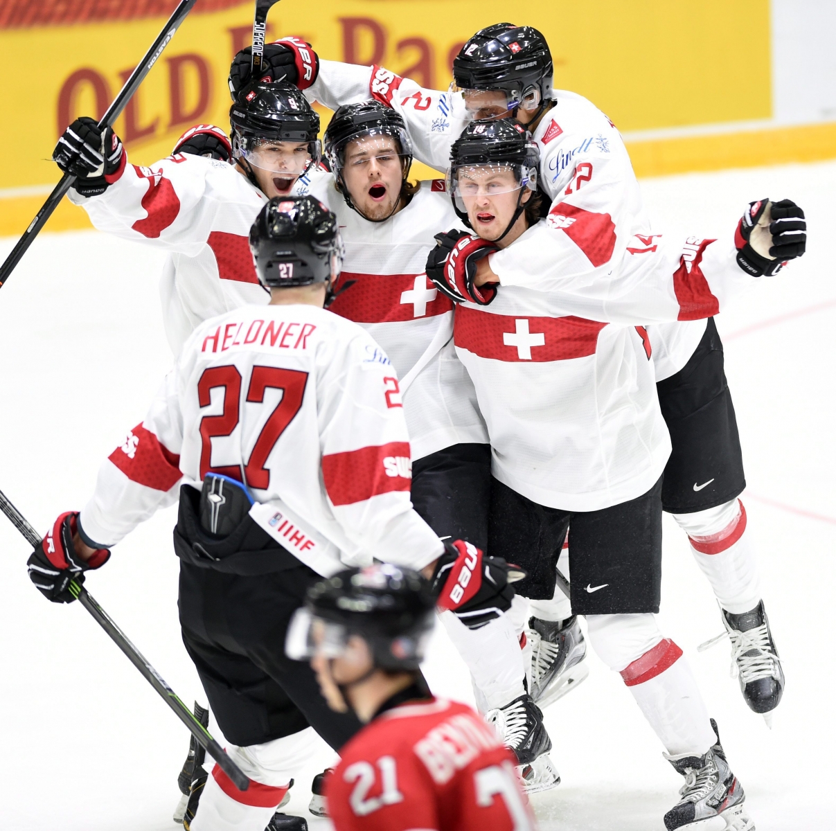 Switzerland's Dario Meyer (right, #14) celebrates his goal with teammates during first-period preliminary hockey game action against Canada at the IIHF World Junior Ice Hockey Championship in Helsinki, Finland, Tuesday, Dec. 29, 2015. (Sean Kilpatrick /The Canadian Press via AP) MANDATORY CREDIT Finland World Junior Hockey Canada Switzerland