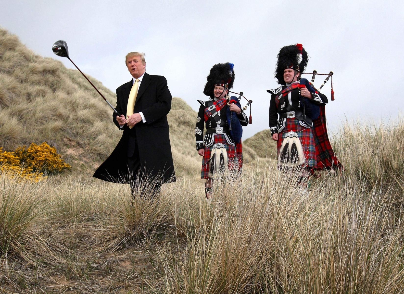US billionaire Donald Trump swings a golf club in the sand dunes of the Menie Estate, on the Aberdeenshire coast, Scotland Thursday May 27, 2010, the location of his planned $1.5 billion Scottish golf resort. Protesters opposed to Trump's planned luxury resort say they've pulled a trick shot out of their bag. At the center of the plan is local fisherman Michael Forbes, who has long been an irritant to Trump. Forbes has refused the American tycoon's offer of nearly $700,000 (488,000 pounds) to buy his family's 23-acre run-down farm, which sits at the center of the planned resort. But Forbes has sold an acre of his land near Aberdeen to protesters who also disagree with Trump's plans _ a sale which will force the property tycoon to face down more than 60 people.   (AP Photo/Andrew Milligan/PA Wire)  ** UNITED KINGDOM OUT NO SALES NO ARCHIVE  ** Britain Trump