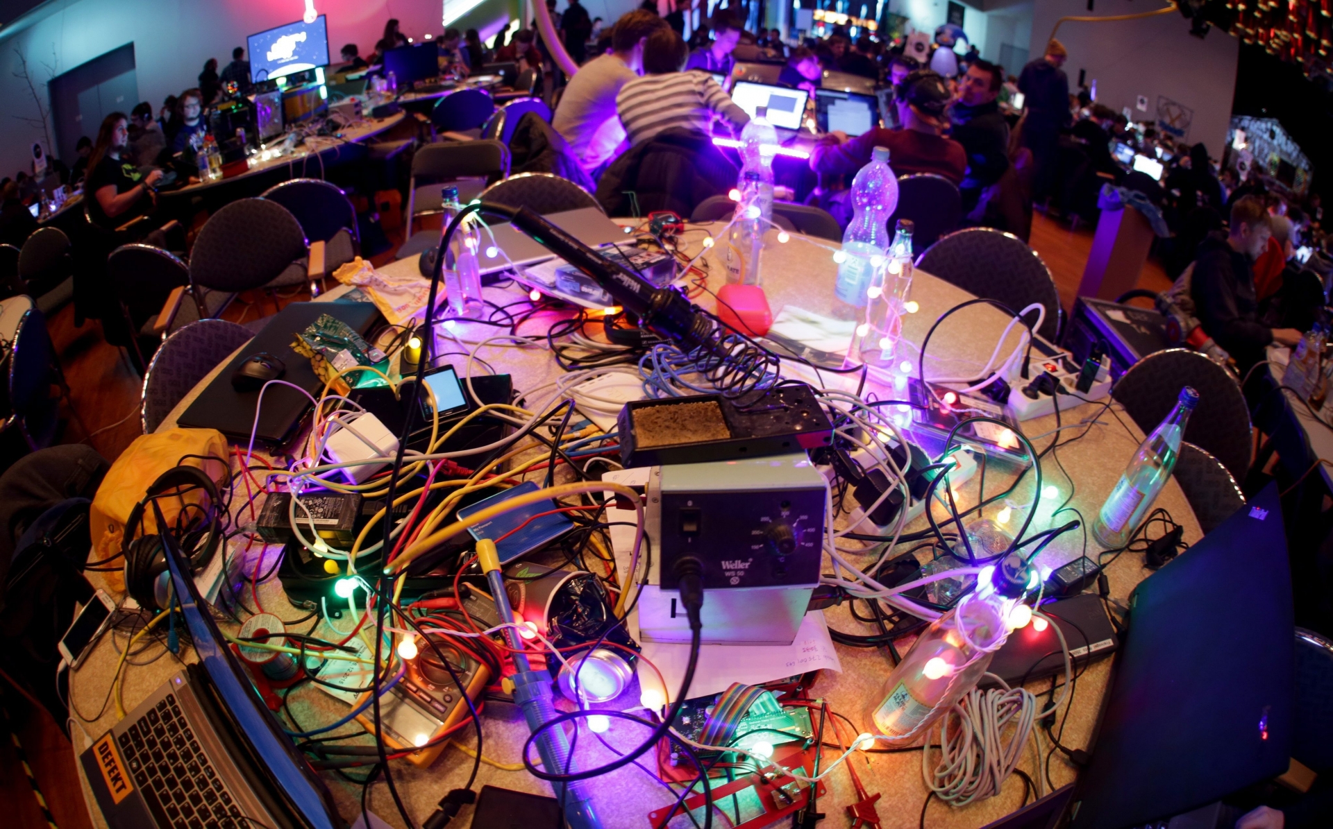 epa05082351 Soldering irons, power plugs, computer wire and illuminated wire are laid out in a room during the congress of the Chaos Computer Club (CCC) at the CCH congress centre in Hamburg, Germany, 28 December 2015. An estimated 12,000 people are expected to attend the convention of the so-called 'Hacker scene' with themes such as internet security, state survellience and creative IT solutions being on the agenda.  EPA/AXEL HEIMKEN GERMANY TECHNOLOGY CHAOS COMPUTER CLUB
