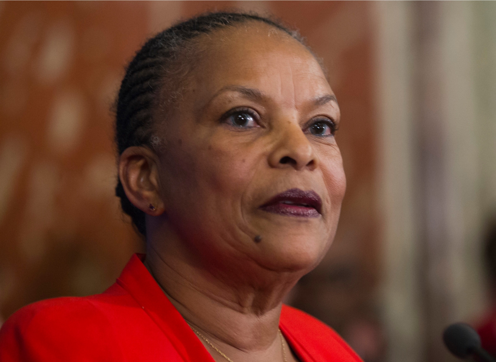 French outgoing Justice Minister Christiane Taubira speaks as she leaves the French Justice Ministry in Paris Wednesday Jan. 27,2016. following the handover ceremony. Frances charismatic justice minister has resigned after objecting to the presidents push to revoke citizenship of convicted terrorists with dual nationality. President Francois Hollande announced Christiane Taubiras resignation  She is a devoted leftist best known for championing the legalization of gay marriage. Taubira is being replaced by Jean-Jacques Urvoas, a Socialist lawmaker from Brittany considered a specialist on security issues who is seen as close to Prime Minister Manuel Valls. (AP Photo/Jacques Brinon)  France Government