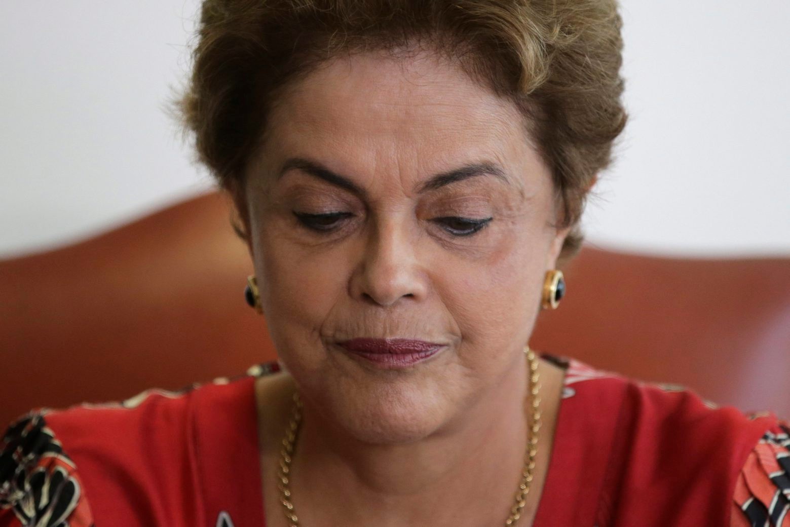 Brazil's President Dilma Rousseff attends a meeting with Brazilian Ambassador Roberto Azevedo, director general of the World Trade Organization, at the Planalto Presidential Palace, in Brasilia, Tuesday, March 29, 2016. Former Brazilian President Luiz Inacio Lula da Silva said Monday that he believes Rousseff, his embattled successor and protege, can survive mounting pressure in Congress for her impeachment. Rousseff recently appointed Silva as her chief of staff in a much-discussed move that still must be confirmed by Brazil's top court. (AP Photo/Eraldo Peres) Brazil Political Crisis