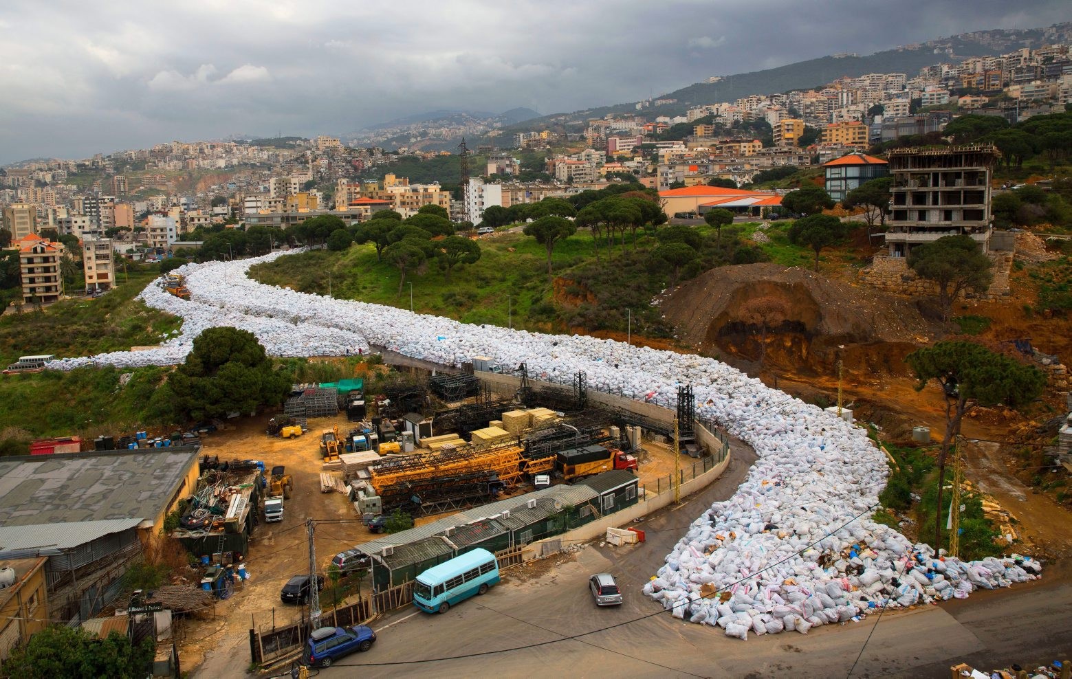 In this picture taken Thursday, March 3, 2016, a general view shows packed garbage bags on a street in Jdeideh, east Beirut, Lebanon. Local governments have been forced to shovel garbage onto the margins of roads and rivers since state authorities closed a major landfill last July without planning for the day after.(AP Photo/Hassan Ammar) APTOPIX Mideast Lebanon Trash