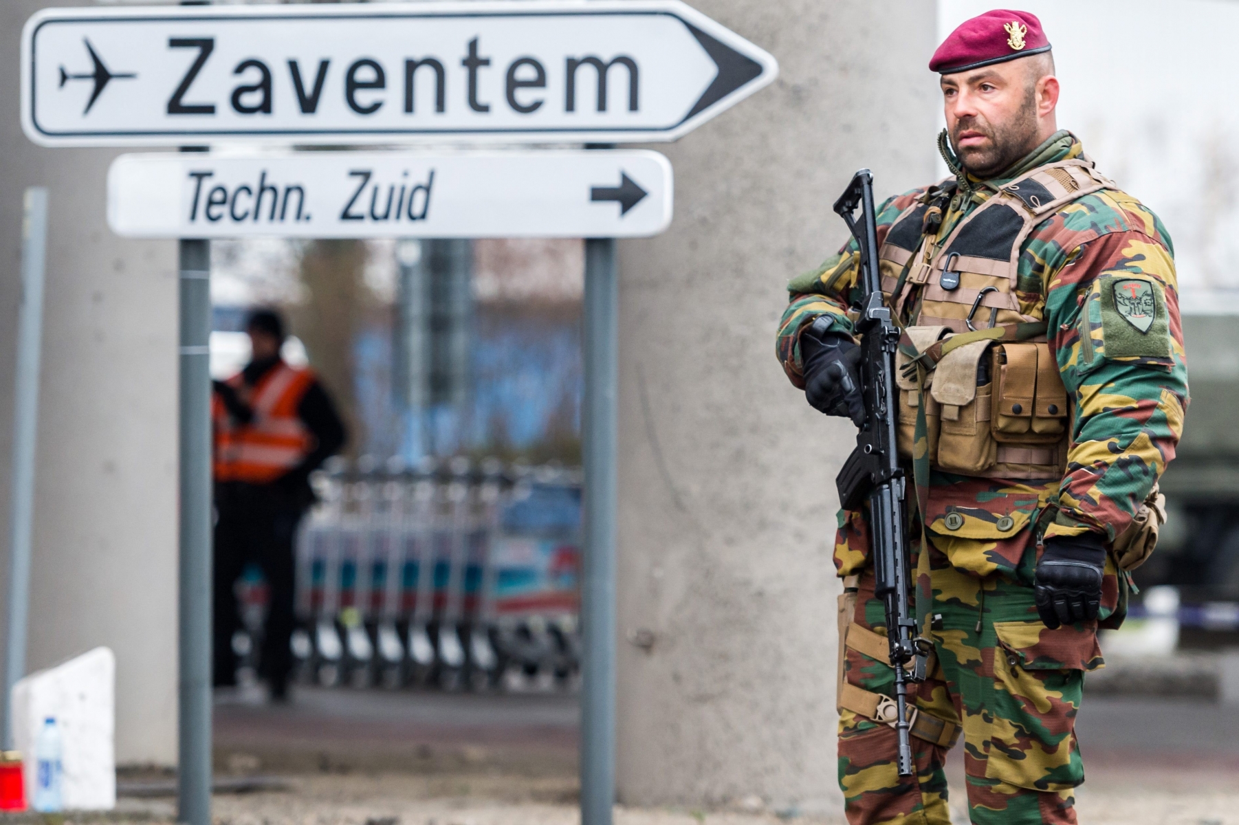 A Belgian Army soldier patrols at Zaventem Airport in Brussels on Wednesday, March 23, 2016. Belgian authorities were searching Wednesday for a top suspect in the country's deadliest attacks in decades, as the European Union's capital awoke under guard and with limited public transport after 34 were killed in bombings on the Brussels airport and a subway station. (AP Photo/Geert Vanden Wijngaert) Belgium Attacks