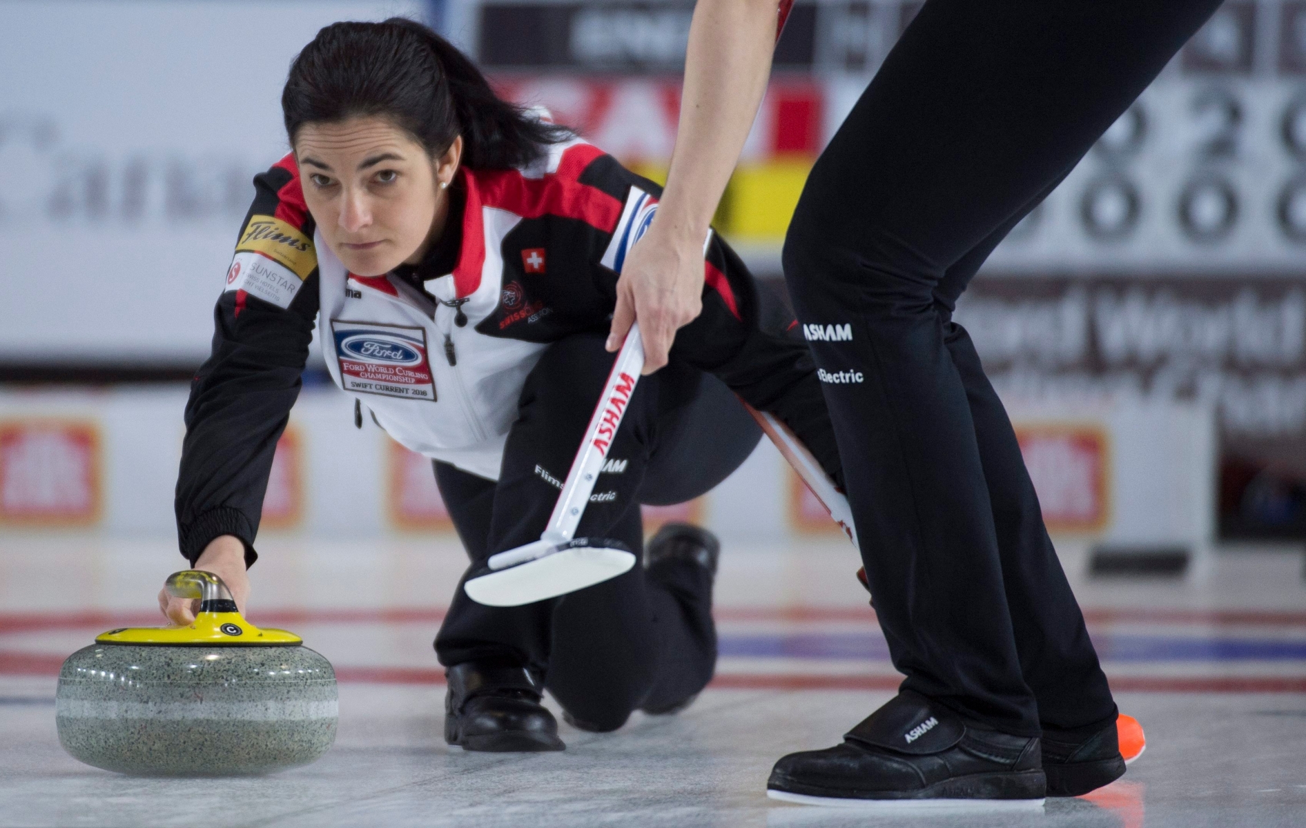 Switzerland skip Binia Feltscher makes a shot during the 3rd draw against Canada at the Women's World Curling Championship in Swift Current, Saskatchewan, Canada, Sunday, March 20, 2016. (Jonathan Hayward/The Canadian Press via AP) MANDATORY CREDIT Canada Womens World Championship Curling