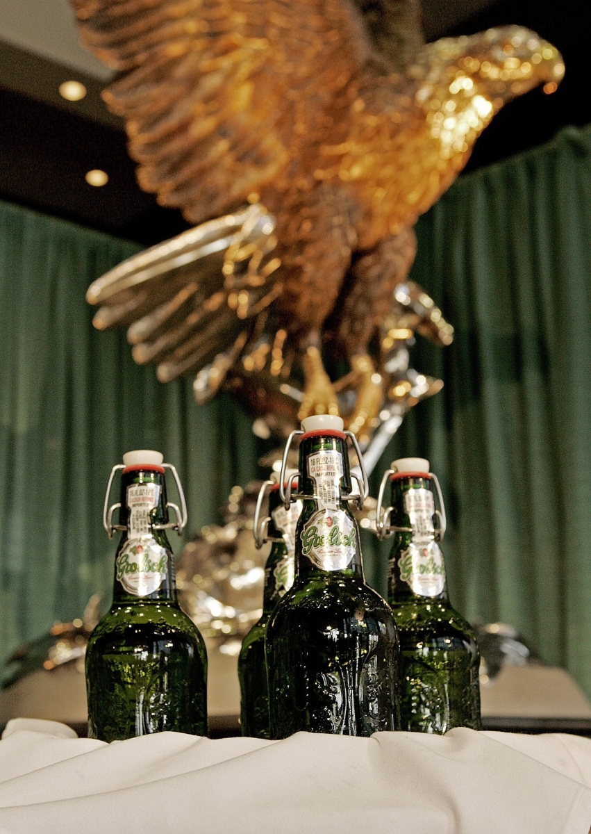 Bottles of Grosch beer, with their iconic "swing-top' bottle closure and green embossed bottle under the Anheuser-Busch eagle in the  lobby of  the company's headquarters in St. Louis Tuesday, Feb. 21, 2006 following a news conference. The nations largest brewer announced an agreement to import the Dutch beer and use the Anheuser-Busch marketing, sales resources and its wholesale network. The eagle is part of the symbol for Anheuser-Busch brands.(AP Photo/James A. Finley) ANHEUSER BUSCH IMPORT