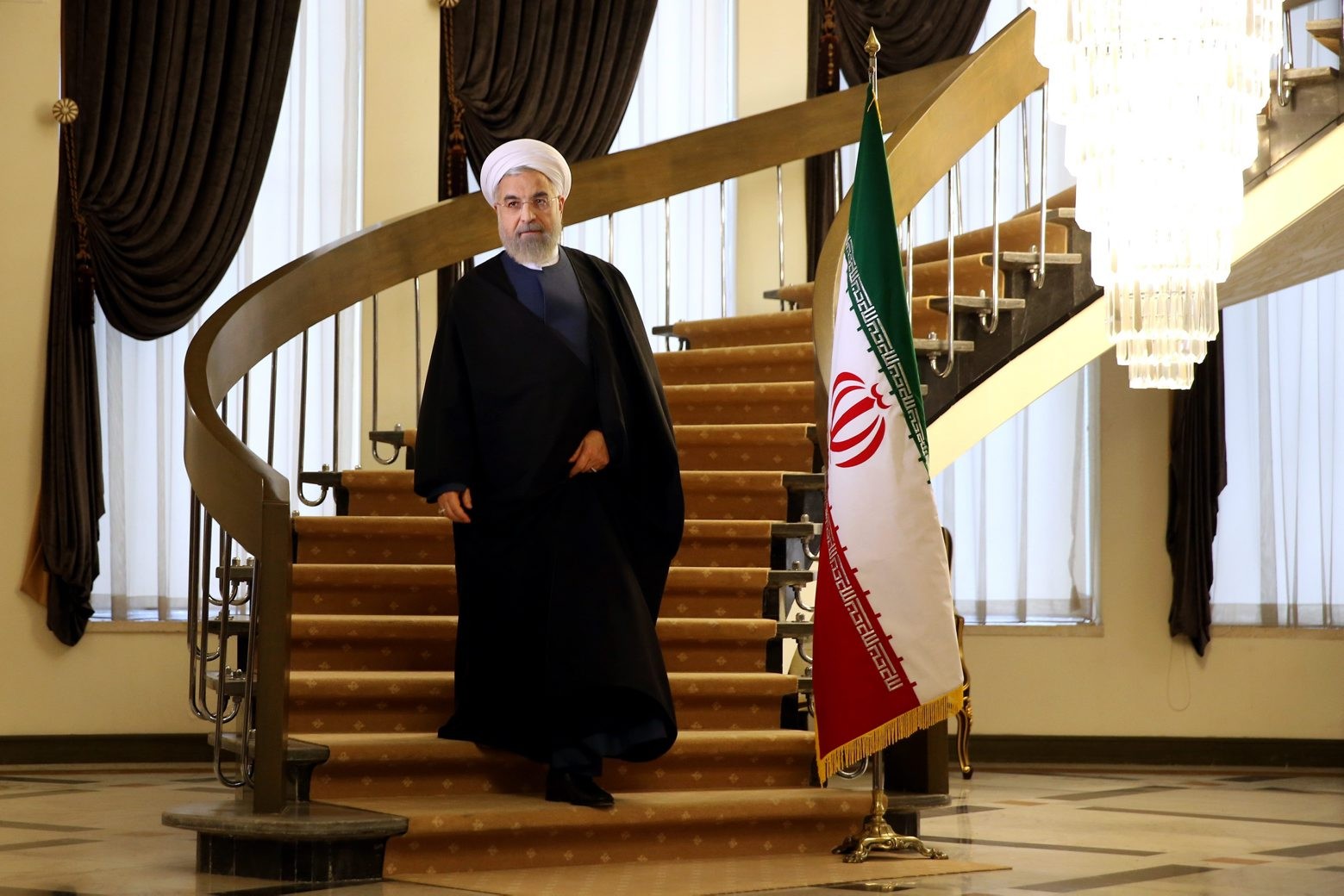 Iranian President Hassan Rouhani arrives for a news briefing at the Saadabad palace in Tehran, Iran, Friday April 3, 2015. Rouhani on Friday pledged that his nation will abide by its commitments in the nuclear agreement reached the previous day in Switzerland. (AP Photo/Ebrahim Noroozi) Mideast Iran
