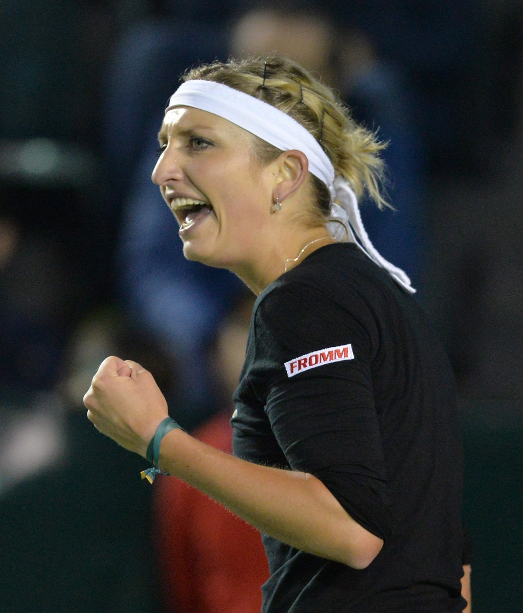 epa04654470 Swiss Timea Bacsinszky celebrates a point against French Caroline Garcia during their finals match of the Monterrey Open, held in  Monterrey, Mexico, 08 March 2015.  EPA/Miguel Sierra MEXICO TENNIS