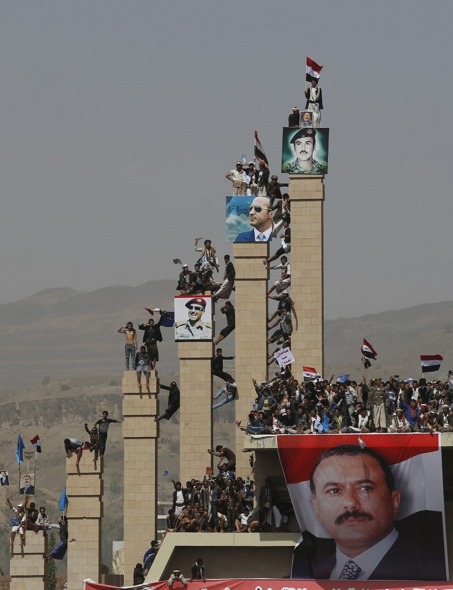 Supporters of the former president Ali Abdullah Saleh attend a rally marking one year for a Saudi-led coalition in Sanaa, Yemen, Saturday, March 26, 2016. (AP Photo/Hani Mohammed) MIDEAST YEMEN