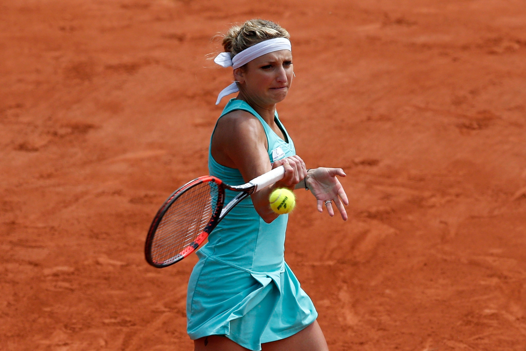 Timea Bacsinszky of Switzerland returns the ball to France's Pauline Parmentier during their third round match of the French Open tennis tournament at the Roland Garros stadium, Saturday, May 28, 2016 in Paris.  (AP Photo/Christophe Ena) France Tennis French Open
