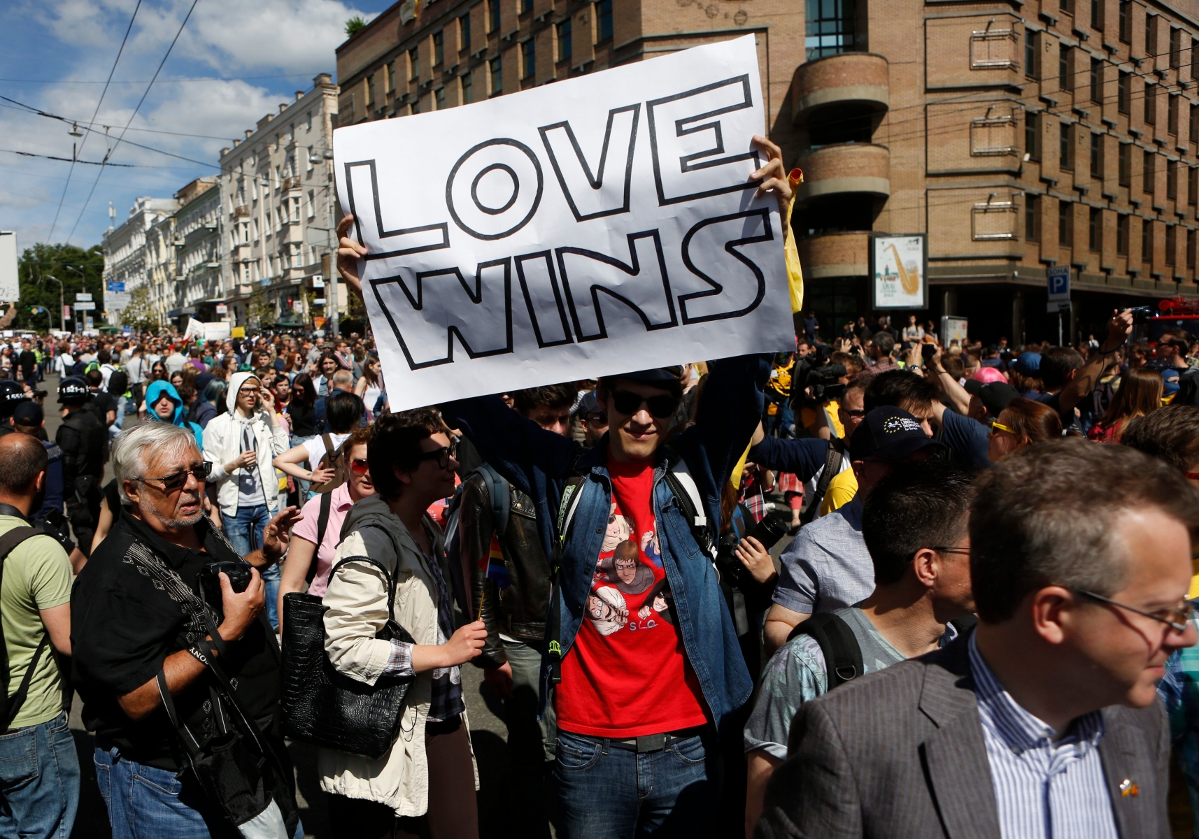 Ukrainian gay rights activists gather for an event in Kiev, Ukraine, Sunday, June 12, 2016.  Authorities sanctioned gay rights marches after the new pro-Western government came into office, and police forces were guarding the procession in central Kiev, Sunday, to protect against far-right groups.(AP Photo/Sergei Chuzavkov) Ukraine Gay Rights