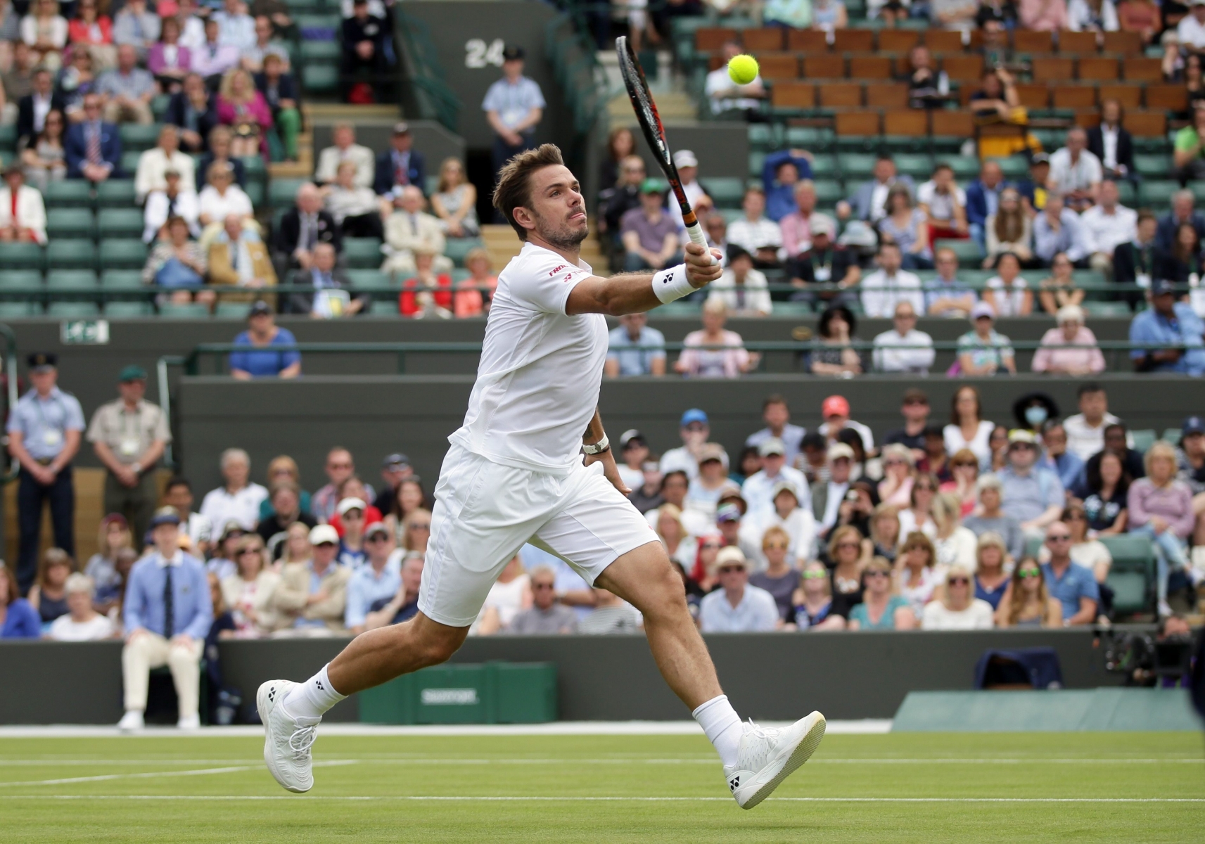 Stan Wawrinka of Switzerland plays a return to Taylor Fritz of the U.S during their men's singles match on day two of the Wimbledon Tennis Championships in London, Tuesday, June 28, 2016. (AP Photo/Tim Ireland) Britain Wimbledon Tennis