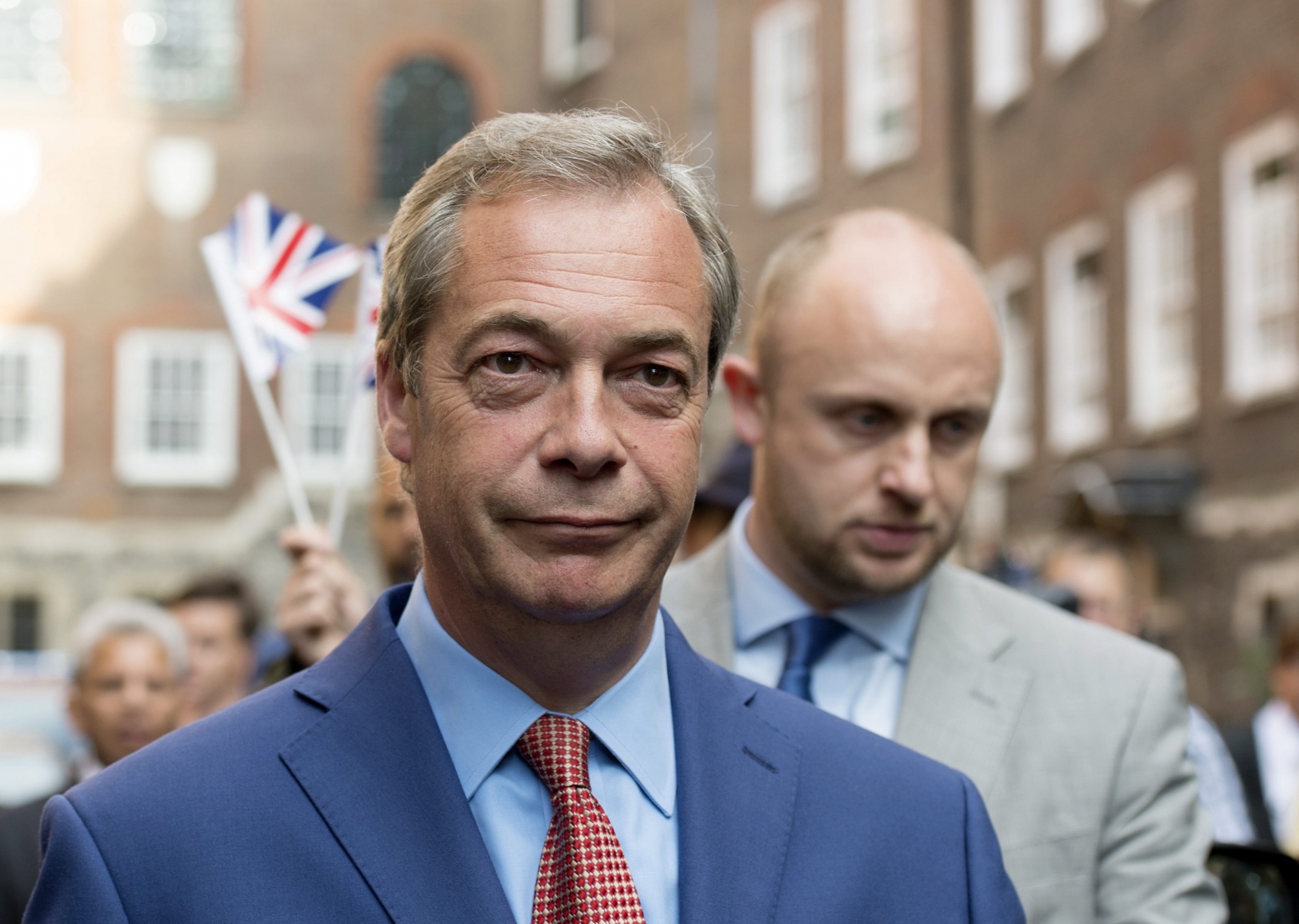 epa05387175 Leader of the United Kingdom (UK) Independence Party Nigel Farage walks through a street in central London, Britain, 24 June 2016. Britons in a referendum on 23 June have voted by a narrow margin to leave the European Union (EU). Media reports on early 24 June indicate that 51.9 per cent voted in favour of leaving the EU while 48.1 per cent voted for remaining in.  EPA/HANNAH MCKAY  EPA/HANNAH MCKAY