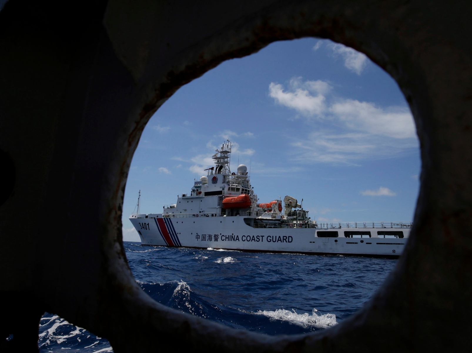 In this photo taken March 29, 2014, a Chinese Coast Guard ship attempts to block a Philippine government vessel as the latter tries to enter Second Thomas Shoal to relieve Philippine troops and resupply provisions. The Permanent Court of Arbitration (PCA) issued its ruling Tuesday, July 12, 2016, in The Hague in response to an arbitration case brought by the Philippines against China regarding the South China Sea, saying that any historic rights to resources that China may have had were wiped out if they are incompatible with exclusive economic zones established under a U.N. treaty. (AP Photo/Bullit Marquez) Philippines South China Sea Ruling
