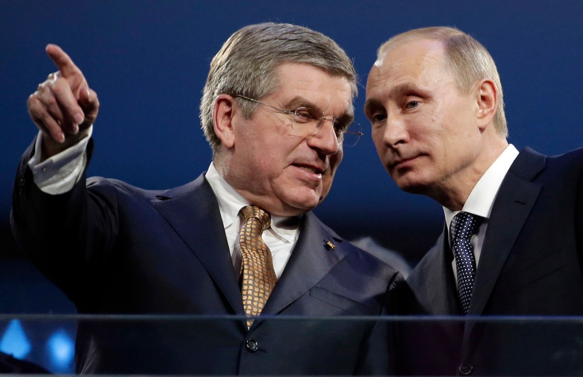 FILE - In this Feb. 23, 2014 file photo International Olympic Committee President Thomas Bach, left, and Russian President Vladimir Putin watch the closing ceremony of the 2014 Winter Olympics in Sochi, Russia. The executive board of the International Olympic Committee has a teleconference on Tuesday, July 19, 2016 to go over options in the wake of a report that uncovered a state-run doping scheme in Russia. After receiving the evidence from the report it commissioned, the World Anti-Doping Agency called for the IOC to consider a ban of Russia's entire Olympic team. (AP Photo/Charlie Riedel, file) Russia Doping