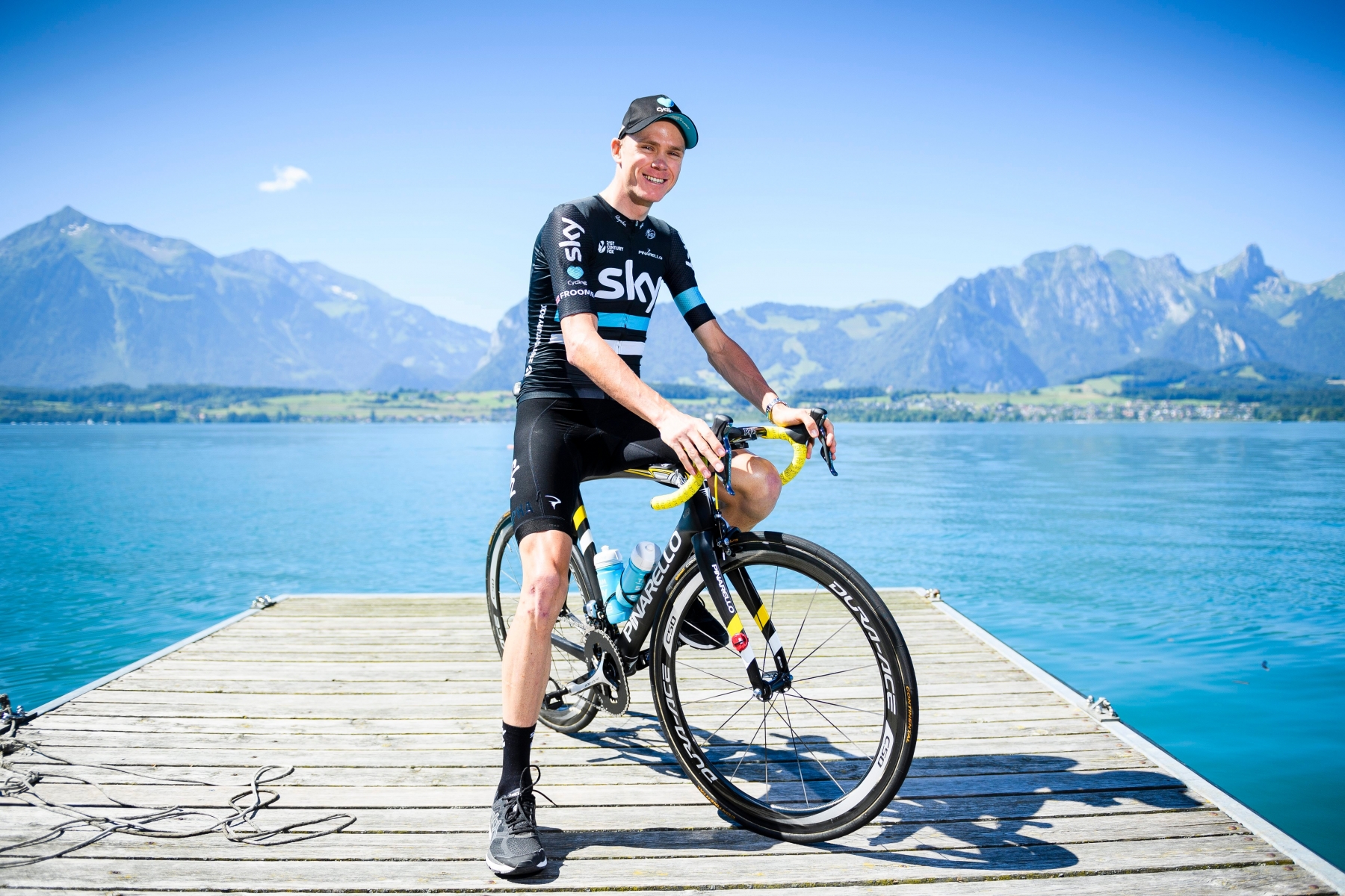 Current leader Chris Froome from Britain poses for a picture in front of the swiss alps at the shore of lake Thun on the rest day before the 17th stage of the 103rd edition of the Tour de France cycling race over 209km between Bern and Finhaut in Switzerland, in Hilterfingen, Tuesday, July 19, 2016. (KEYSTONE/Manuel Lopez) SWITZERLAND TOUR DE FRANCE 2016
