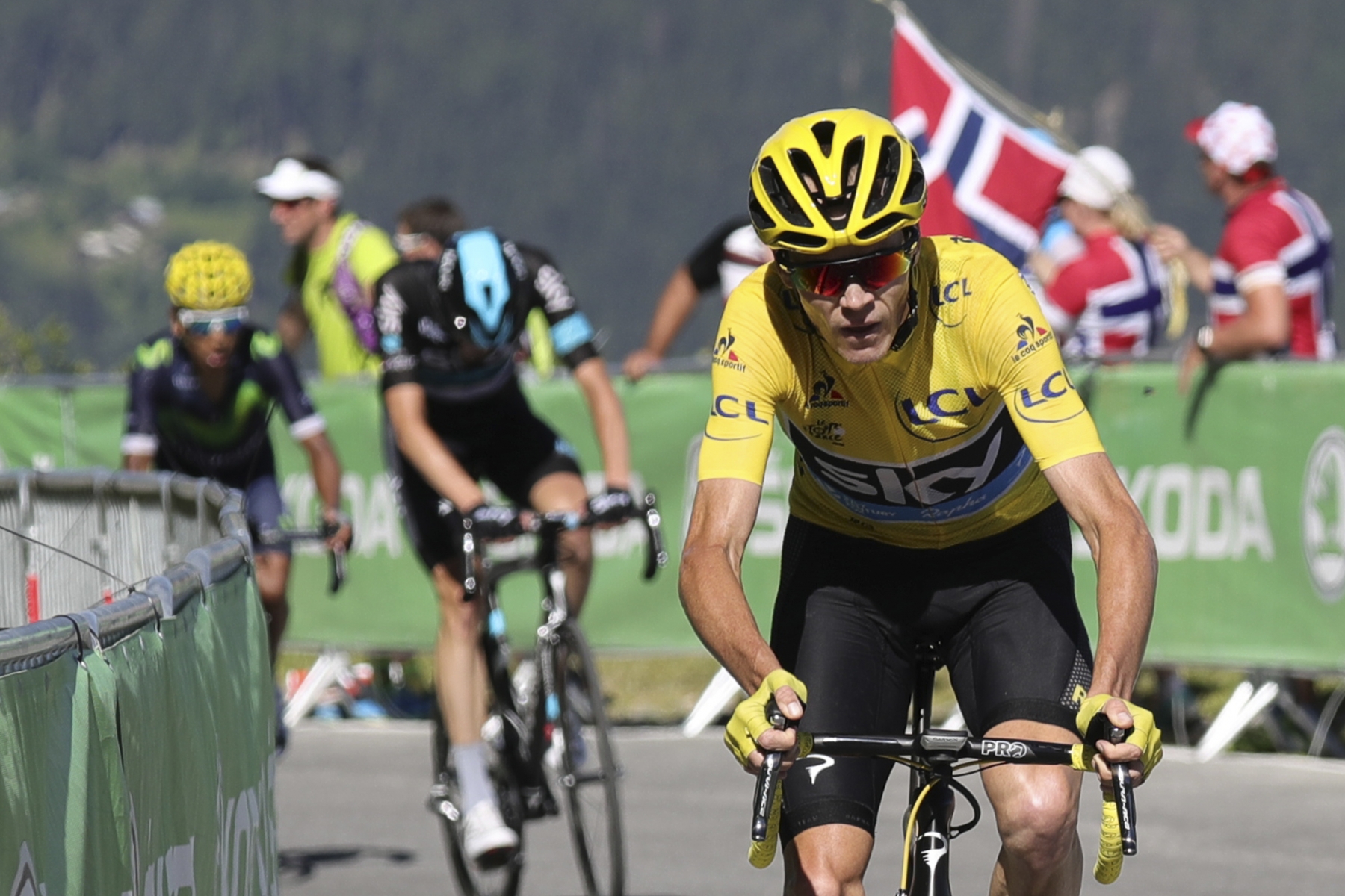 Britain's Chris Froome, wearing the overall leader's yellow jersey, breaks away from Colombia's Nairo Quintana, rear left, during the seventeenth stage of the Tour de France cycling race over 184.5 kilometers (114.3 miles) with start in Bern and finish in Finhaut-Emosson, Switzerland, Wednesday, July 20, 2016. (Kenzo Tribouillard via AP Photo) France Cycling Tour de France